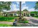 Well-manicured lawn and landscaping, showcasing the beauty of the home's architecture at 11015 Hawkshead Ct, Windermere, FL 34786