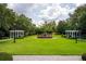 Expansive green space featuring a central water fountain and picturesque landscaping at 11015 Hawkshead Ct, Windermere, FL 34786