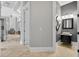 Bright foyer featuring travertine flooring and a view to a powder room at 11015 Hawkshead Ct, Windermere, FL 34786
