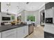 Expansive kitchen with an island, modern appliances, and connection to the breakfast nook at 11015 Hawkshead Ct, Windermere, FL 34786