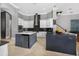 Large kitchen featuring white cabinets, stainless steel appliances and dark countertops at 11015 Hawkshead Ct, Windermere, FL 34786