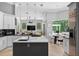 Spacious kitchen with island, stainless appliances, and adjacent breakfast nook with backyard views at 11015 Hawkshead Ct, Windermere, FL 34786