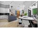 Open-concept kitchen with white cabinets, center island, and adjacent dining area at 11015 Hawkshead Ct, Windermere, FL 34786