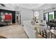 Open concept living area with tile floors, modern decor, and access to dining room at 11015 Hawkshead Ct, Windermere, FL 34786