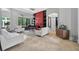 Bright and airy living room with tile floors, a grand piano, and modern decor at 11015 Hawkshead Ct, Windermere, FL 34786