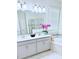 Elegant bathroom with double vanity, soaking tub, and a separate glass-enclosed shower at 11408 Satire St, Orlando, FL 32832