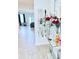 Inviting entryway with hardwood floors and elegant decorations on a mirrored console table at 11408 Satire St, Orlando, FL 32832
