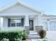 Beautiful home exterior with a covered porch and a two-car garage at 11408 Satire St, Orlando, FL 32832