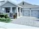 Beautiful home with a two-car garage and a manicured front yard at 11408 Satire St, Orlando, FL 32832