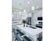 Modern kitchen showcasing a stylish island with barstools and pendant lighting at 11408 Satire St, Orlando, FL 32832