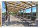 Shaded lounge area features comfortable seating, offering a relaxing space by the community pool at 11408 Satire St, Orlando, FL 32832