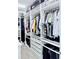 Spacious walk-in closet with custom shelving, ample hanging space, and organized storage solutions at 11408 Satire St, Orlando, FL 32832