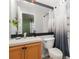 Well-lit bathroom featuring vanity, shower with stylish curtain, and modern fixtures at 1178 Vineland Pl, Lake Mary, FL 32746