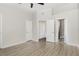 Bright, airy bedroom with ceiling fan, light walls, and ample closet space at 1178 Vineland Pl, Lake Mary, FL 32746