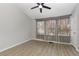 Spacious bedroom featuring stylish lighting, a ceiling fan and modern window treatments at 1178 Vineland Pl, Lake Mary, FL 32746