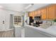 Well-lit kitchen with stainless steel appliances, ample counter space, and a garden view at 1178 Vineland Pl, Lake Mary, FL 32746