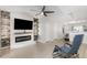 Modern living room featuring an electric fireplace and decorative wall accents at 1178 Vineland Pl, Lake Mary, FL 32746