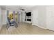 Bright living room with stylish ceiling fan, electric fireplace, and sliding glass doors at 1178 Vineland Pl, Lake Mary, FL 32746