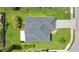 Aerial shot showcases the home's roof, landscaping, and driveway at 1406 Sean Ct, St Cloud, FL 34772