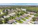 An aerial view shows the location of the neighborhood near a pond at 1406 Sean Ct, St Cloud, FL 34772