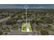 Expansive aerial view of a single-Gathering home featuring a well-manicured lawn and mature trees in a suburban neighborhood at 1406 Sean Ct, St Cloud, FL 34772