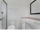 This bathroom has a walk-in shower, a toilet, and a vanity with a mirror at 1406 Sean Ct, St Cloud, FL 34772
