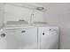 The laundry room features a white washer and dryer set at 1406 Sean Ct, St Cloud, FL 34772