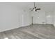 Spacious living room with modern flooring, ceiling fan, and ample natural light at 1406 Sean Ct, St Cloud, FL 34772