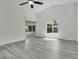 Bright living room featuring tile flooring, sliding door access, and ample sunlight at 1406 Sean Ct, St Cloud, FL 34772