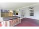 Enclosed patio featuring a hot tub, ceiling fan, and sliding glass doors at 1406 Sean Ct, St Cloud, FL 34772