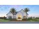 Beautiful community clubhouse with palm trees and colorful landscaping at 1508 Stonecliff Dr, Apopka, FL 32703