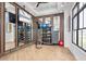 Modern gym with fitness equipment, mirrors, and natural light at 1508 Stonecliff Dr, Apopka, FL 32703