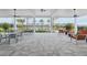 Outdoor patio with dining and lounge seating overlooking the community pool at 1508 Stonecliff Dr, Apopka, FL 32703