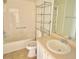 Bathroom featuring a bathtub, vanity with sink, toilet, and a chrome storage shelf at 1524 Conway Ct, The Villages, FL 32162