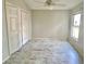 Bright bedroom with wood-look floors, a window, and a closet offering plenty of space at 1524 Conway Ct, The Villages, FL 32162
