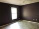 Comfortable bedroom with ample natural light showcasing a window and warm, painted walls at 1524 Conway Ct, The Villages, FL 32162