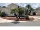 Charming single-story home featuring well-maintained landscaping with palm trees and neutral exterior paint at 1524 Conway Ct, The Villages, FL 32162