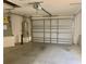 A spacious two car garage with water heater and garage door opener at 1524 Conway Ct, The Villages, FL 32162