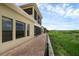 Back exterior view of home showcasing patio, yard and lake views at 15344 Johns Lake Pointe Blvd, Winter Garden, FL 34787
