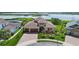 Stunning two-story home with a well-manicured lawn, mature trees, and a three car garage at 15344 Johns Lake Pointe Blvd, Winter Garden, FL 34787