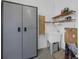 Spacious garage with storage cabinet, utility sink and shelving at 15344 Johns Lake Pointe Blvd, Winter Garden, FL 34787