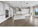 Spacious kitchen with white cabinets, stainless steel appliances, and a large island at 15344 Johns Lake Pointe Blvd, Winter Garden, FL 34787