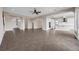 Large living area features tile floors, an open floor plan and seamless access to the kitchen at 15344 Johns Lake Pointe Blvd, Winter Garden, FL 34787
