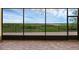 Covered patio with brick pavers and sliding glass doors to capture outdoor views at 15344 Johns Lake Pointe Blvd, Winter Garden, FL 34787