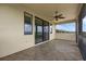 Outdoor covered porch featuring tile flooring, a ceiling fan, and scenic views of the surrounding landscape at 15344 Johns Lake Pointe Blvd, Winter Garden, FL 34787