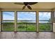 Spacious screened porch provides panoramic views of the lake and surrounding landscape at 15344 Johns Lake Pointe Blvd, Winter Garden, FL 34787