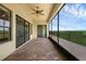 Extended screened porch features brick flooring and multiple entryways, enhancing outdoor living at 15344 Johns Lake Pointe Blvd, Winter Garden, FL 34787