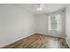 Bedroom featuring laminate flooring, ceiling fan, and a window offering a comfortable and private space at 1575 Downy Birch Ln, Longwood, FL 32750