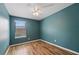 Bright bedroom featuring laminate flooring, and a window offering a comfortable and private space at 1575 Downy Birch Ln, Longwood, FL 32750