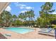 Enjoy the community pool with lounge chairs and mature trees that provide shady spots to relax at 1575 Downy Birch Ln, Longwood, FL 32750